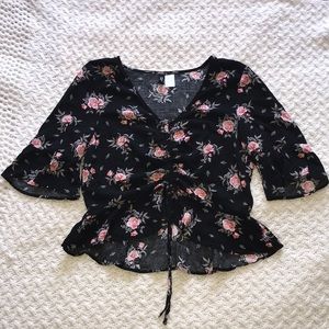 Floral top with drawstring in the middle.